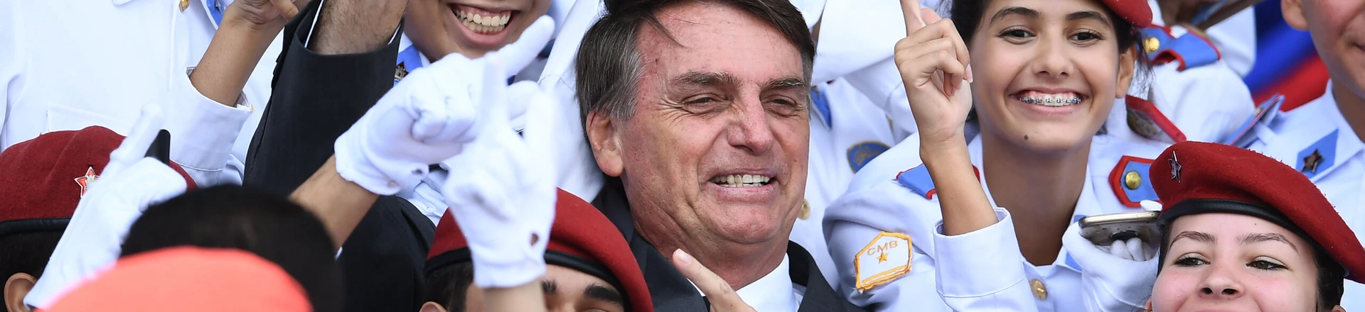 Brazilian congressman and presidential canditate for the next presidential election, Jair Bolsonaro (C), poses for pictures with students of Brasilia's Military School after a parade on the Brazilian Army commemorative day,in Brasilia, on April 19, 2018. (Photo by EVARISTO SA / AFP) (Photo credit should read EVARISTO SA/AFP/Getty Images) Brazilian congressman and presidential canditate for the next presidential election, Jair Bolsonaro (C), poses for pictures with students of Brasilia's Military School after a parade on the Brazilian Army commemorative day,in Brasilia, on April 19, 2018. (Photo by EVARISTO SA / AFP) (Photo credit should read EVARISTO SA/AFP/Getty Images)