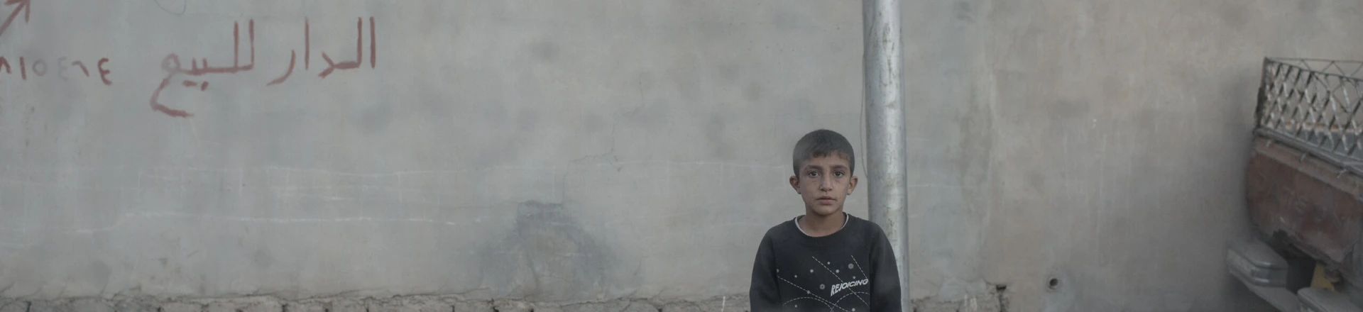 A young boy stares at the photographer through the window of an Iraqi army Humvee in the Karkukli neighborhood of Mosul, Iraq on Nov. 17, 2016. A young boy stares at the photographer through the window of an Iraqi army Humvee in the Karkukli neighborhood of Mosul, Iraq on Nov. 17, 2016.